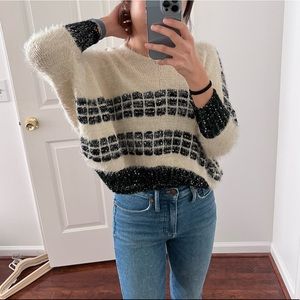 Cream fuzzy sweater with black details